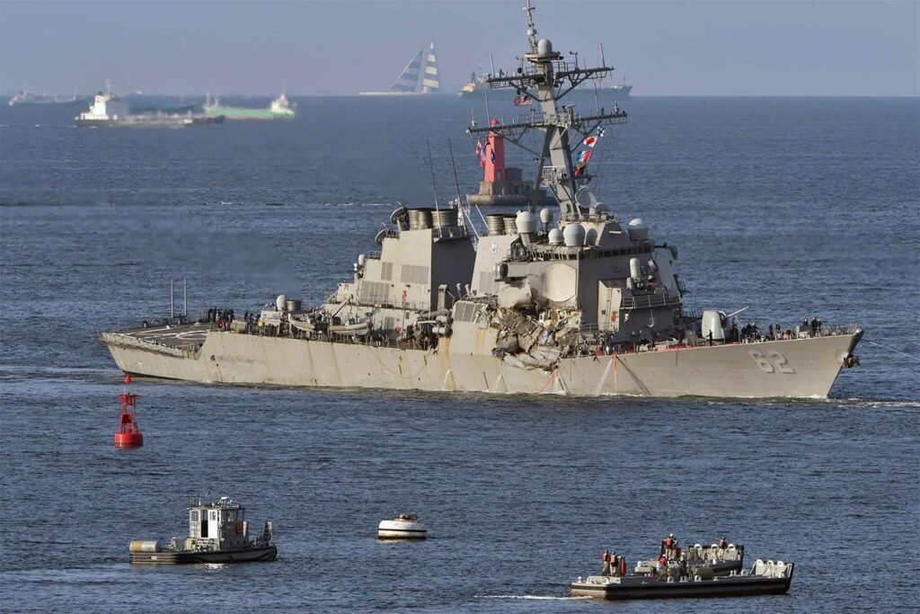 Iran warns US destroyer